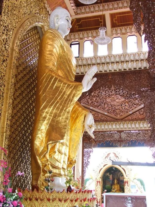 standing buddha burmese temple penang malaysia