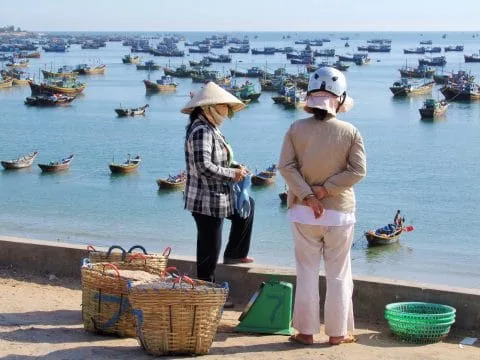 ladies in front of port mui ne vietnam