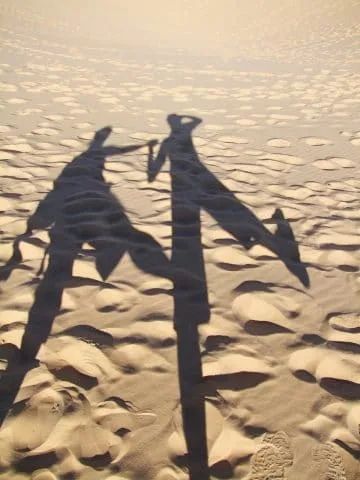 mui ne - our shadows on white dunes - vietnam