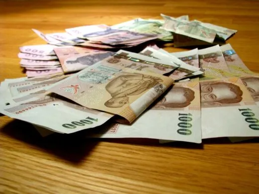 thai baht bills on a table