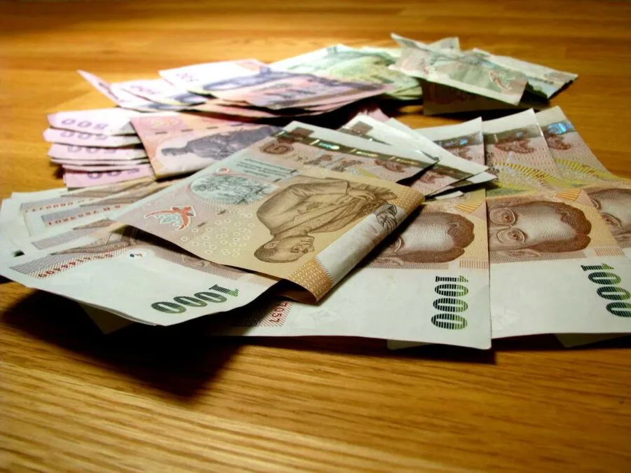 thai baht bills on a table