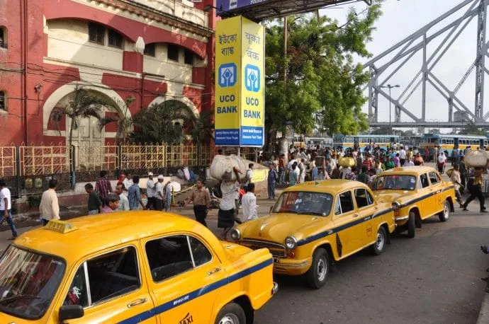 yellow taxis in front of calcutta station - india