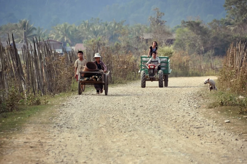 tractor passing through vang vieng