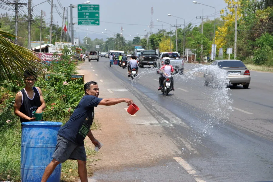 watering passers-by road thailand