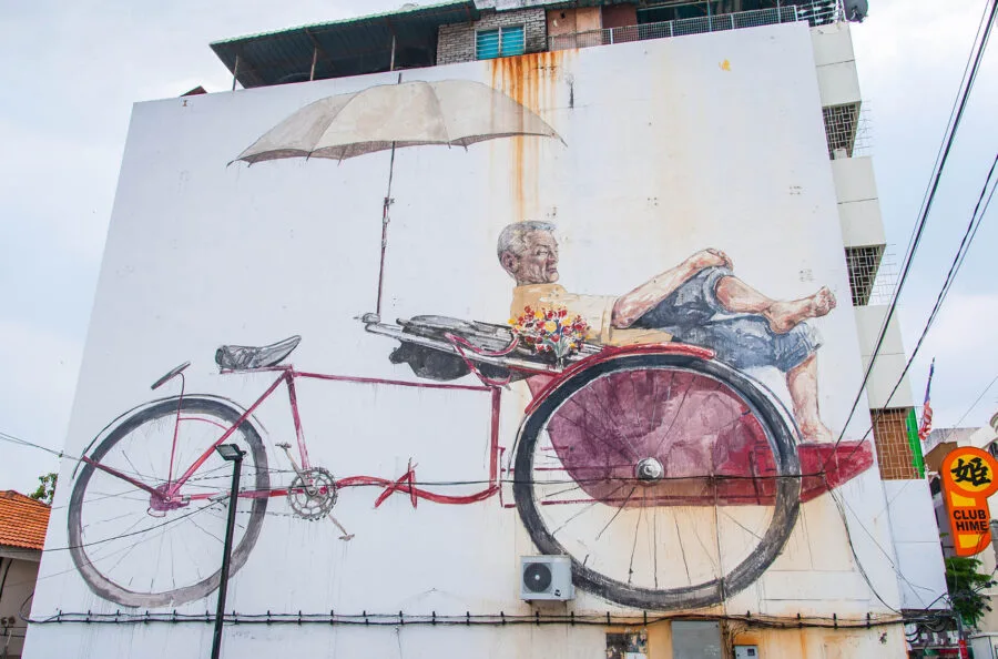 the awaiting trishaw pedaler ernest zacharevic street art penang