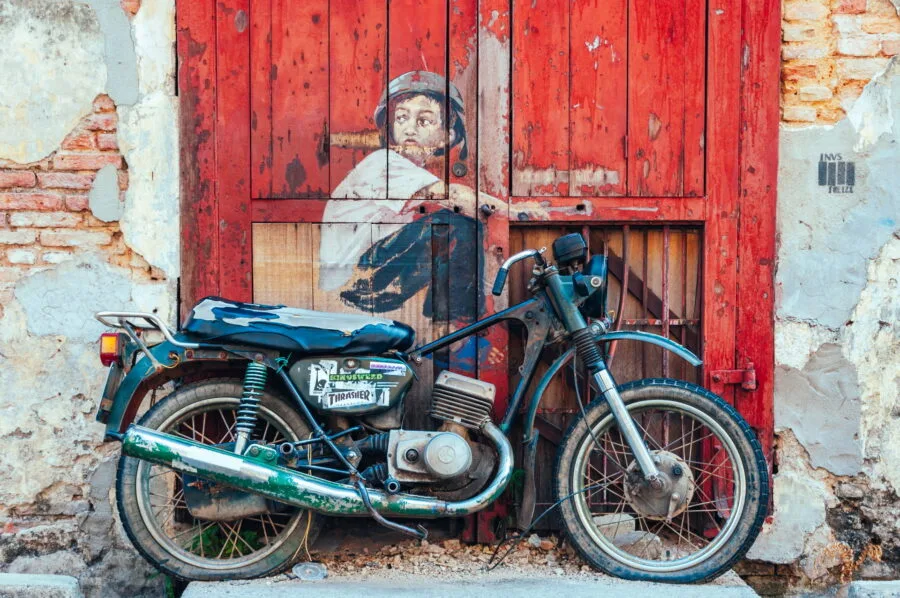 boy on a motorcycle ernest zacharevic street art penang