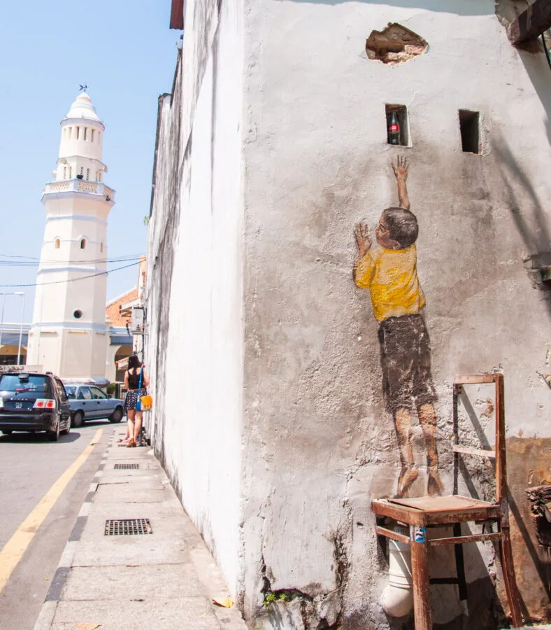 reaching up ernest zacharevic street art penang