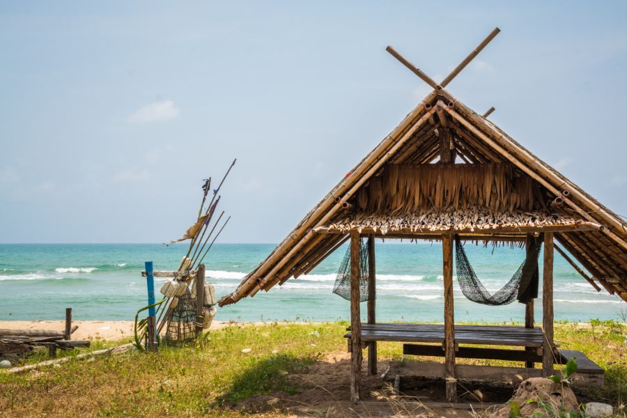 Bamboo hut with hammock facing the sea