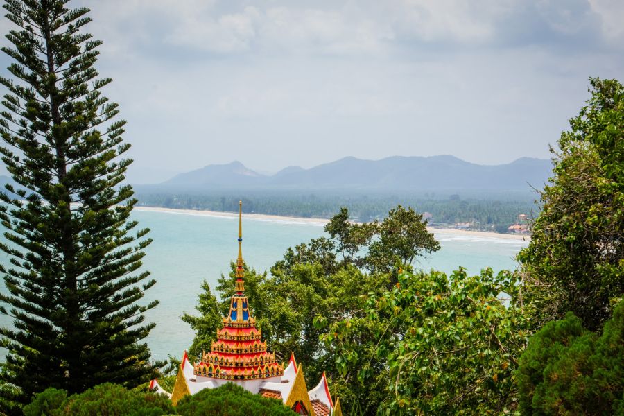 Colorful pagoda overlooking a mountain-fringed bay