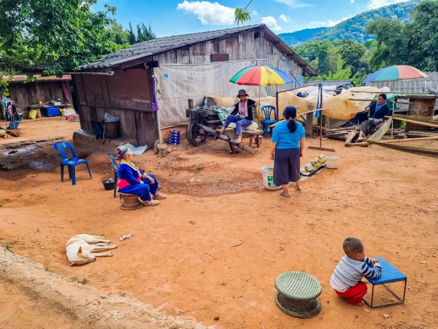 family in a courtyard Hmong village Khun Chang Khian Doi Pui