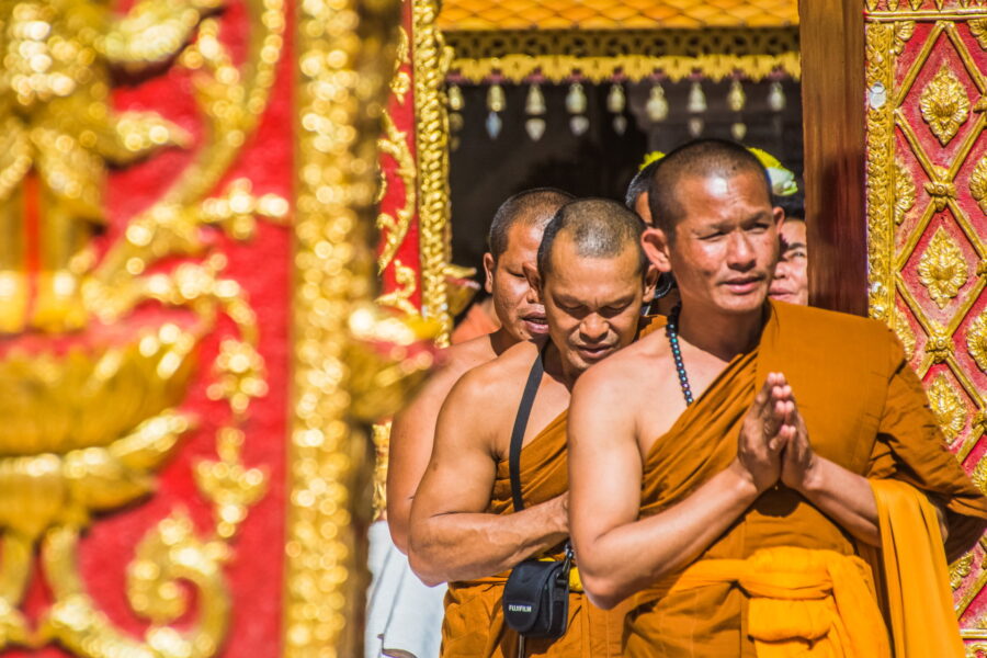 Monks praying around Chedi Wat Phra That Doi Suthep