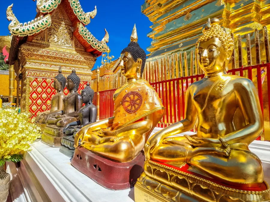 Buddha statues around the chedi Wat Phra That Doi Suthep