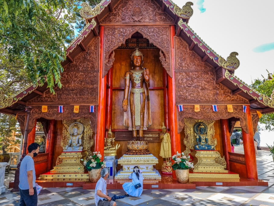 wooden structure with standing Buddha Wat Phra That Doi Suthep
