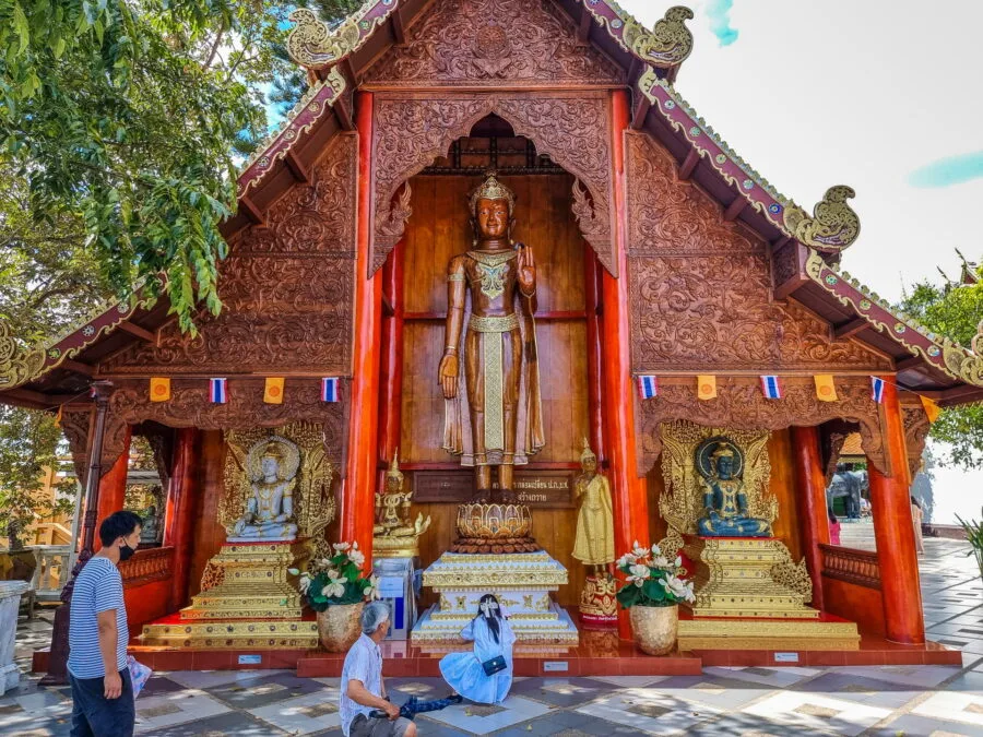 wooden structure with standing Buddha Wat Phra That Doi Suthep