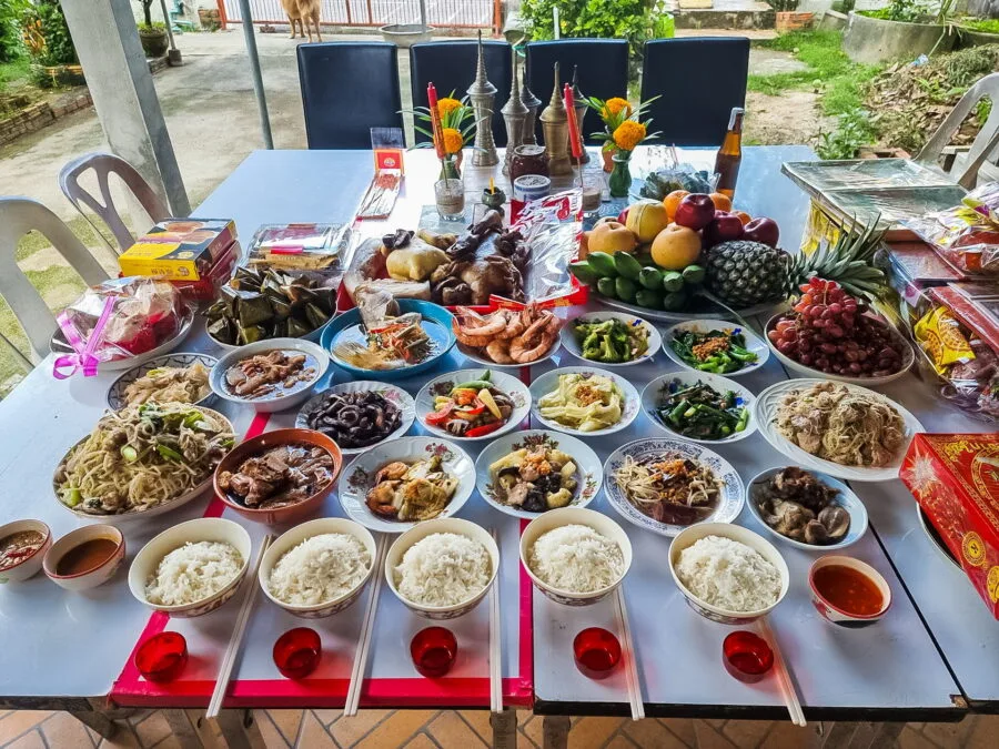 table with dishes and offerings chinese new year thailand
