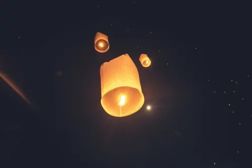 lanterns flying away loy krathong yi peng festival chiang mai - thailand