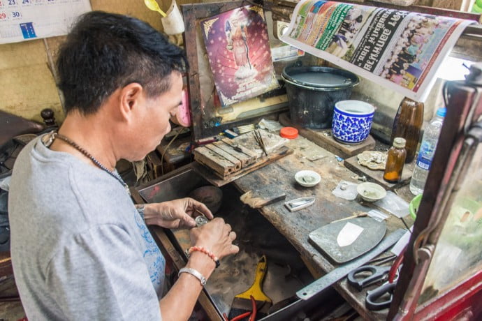 Craftsman at work in a street in Kamphaeng-Phet, Thailand