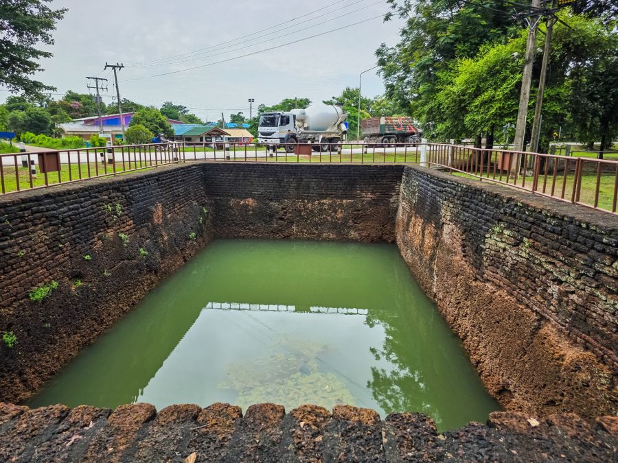 filled pond in front of wat awat yai kamphaeng phet historical park