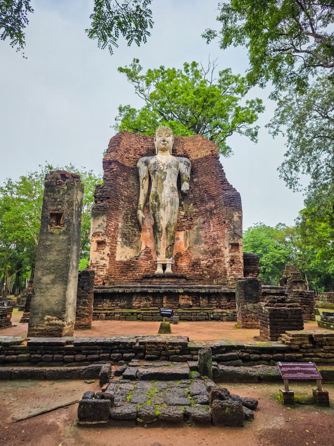 standing buddha at wat phra si iriyabot kamphaeng phet historical park