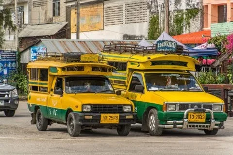 yellow and green songthaew pick-up lampang
