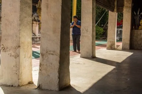 prayer at wat phra that lampang luang thailand