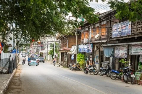 a street in lampang with wooden houses
