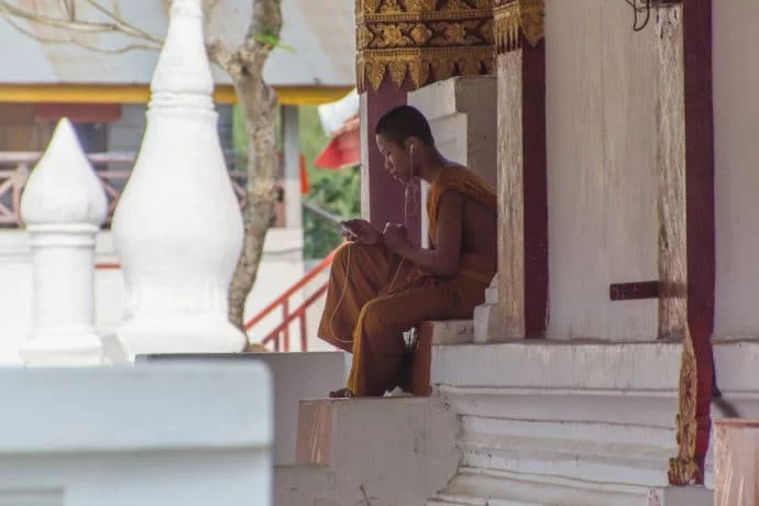 monk at Wat Hosian Voravihane luang prabang - laos