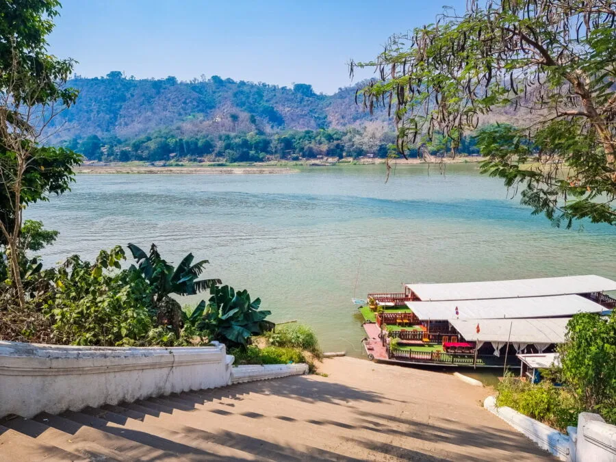 edge of the mekong behind temple vat xieng thong luang prabang