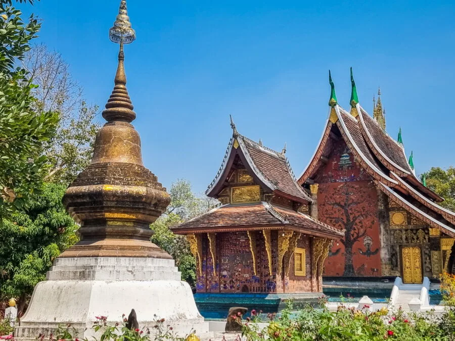 chedi and tripitaka behind vat xieng thong luang prabang