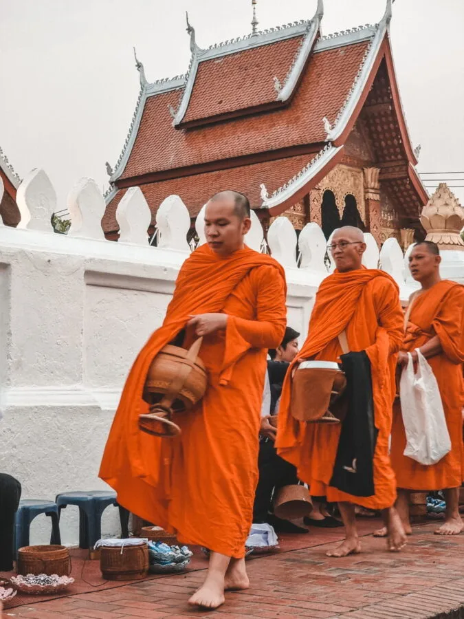 monks marching ceremony tak bat luang prabang