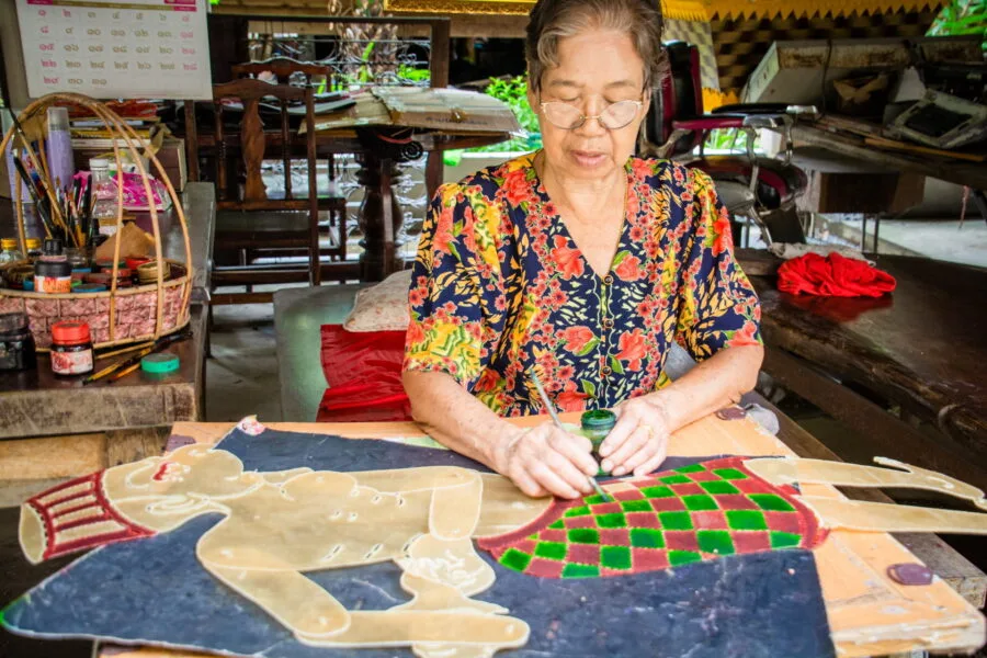 lady applying color suchart subsin shadow puppetry museum nakhon si thammarat