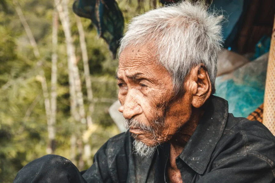 old akha tribe gentleman on the road to doi hua mae kham