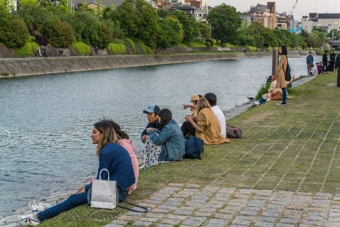 laying on the banks of the kamo kyoto pontocho river