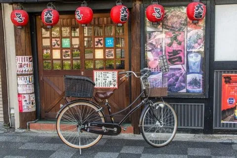 bike in front of restaurant kyoto - japan
