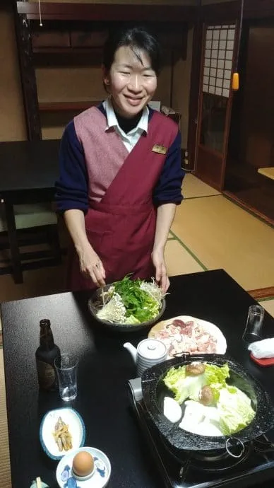 our host preparing dinner kigusuriya ryokan - miyama japan