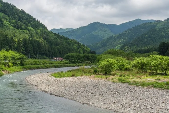 river in front of miyama village kayabuki-no-sato - kyoto prefecture japan