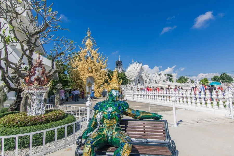 statue entrance white temple wat rong khun chiang rai thailand