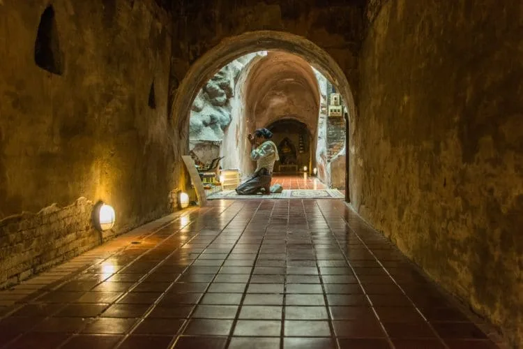 prayer in wat umong tunnel - chiang mai