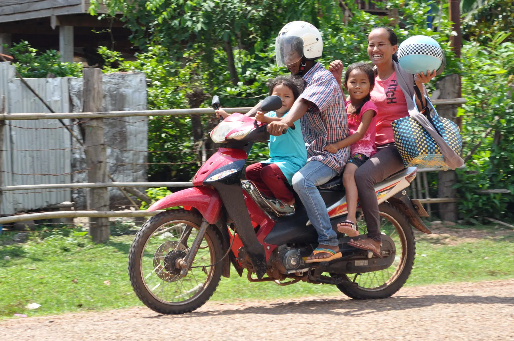 family motorcycle countryside laos