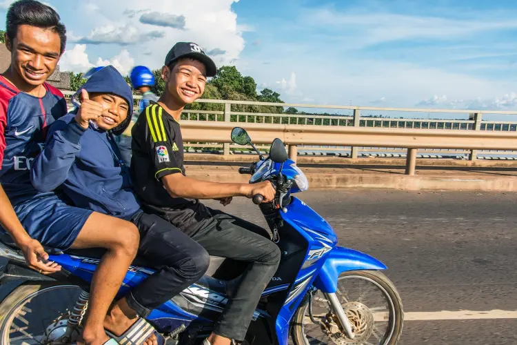 three young motorcycle pakse - south laos