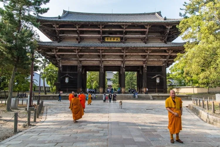 monk in front of south gate nandaimon nara - japan