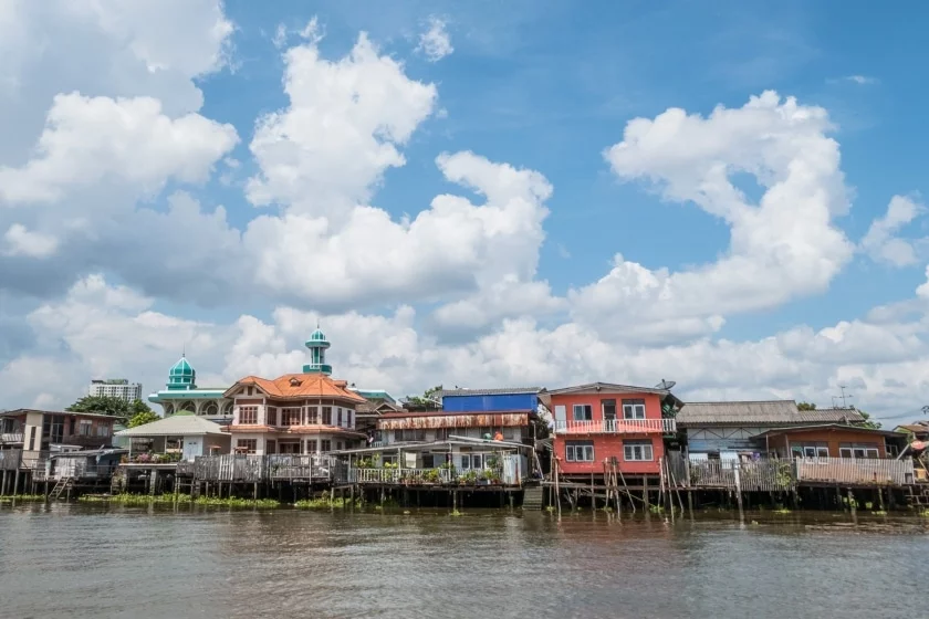 stilt houses on the banks of the chao phraya near nonthaburi