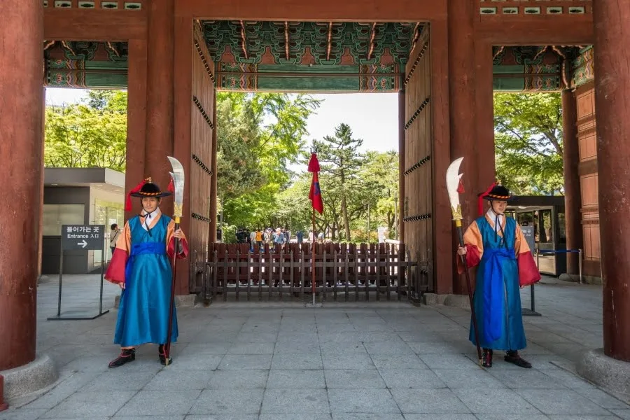 guards in front of gates deoksugung palace seoul