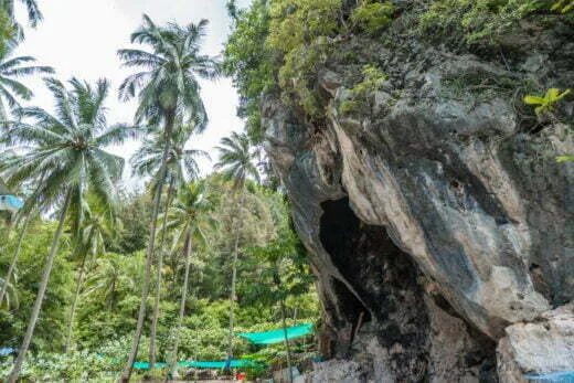 cliff bordering fishing village dan sawit - chumphon