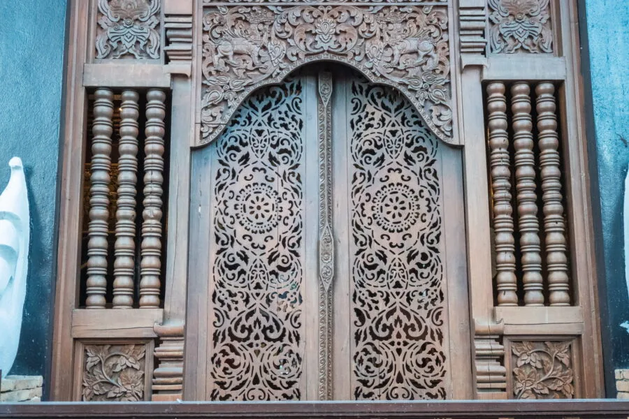 door sculptures - wat lok mali - chiang mai