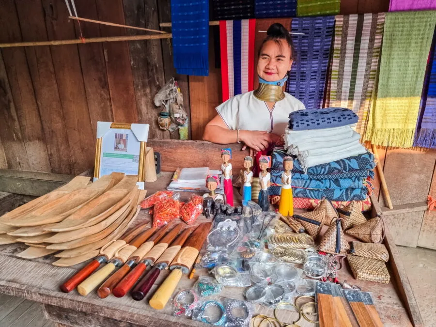 padaung woman behind souvenir stall huay pu keng