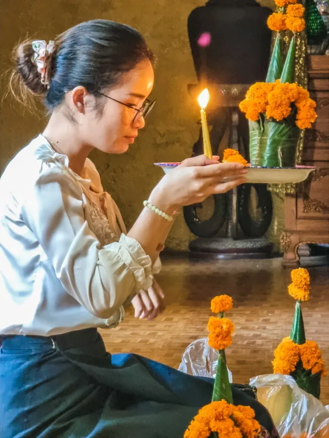 Laotian woman praying at Wat Simuong Vientiane
