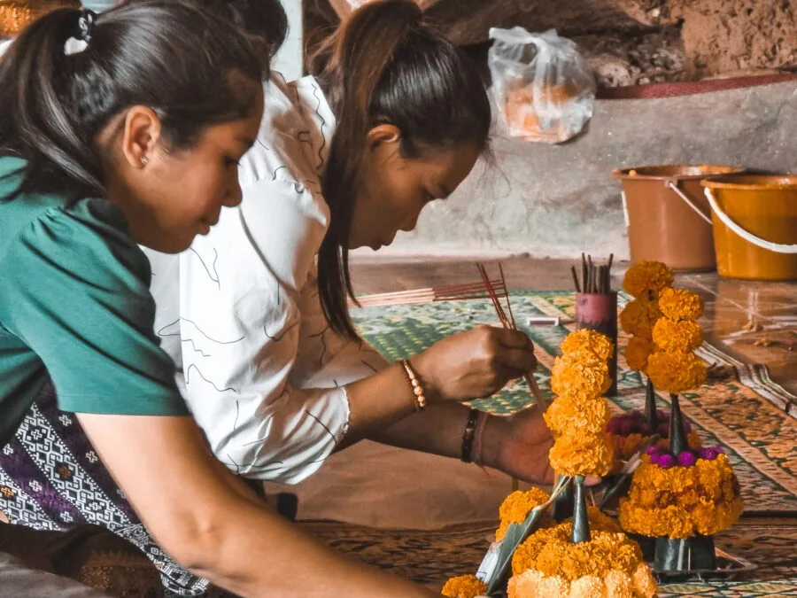 prayer at the Tham Phra temple in Laos
