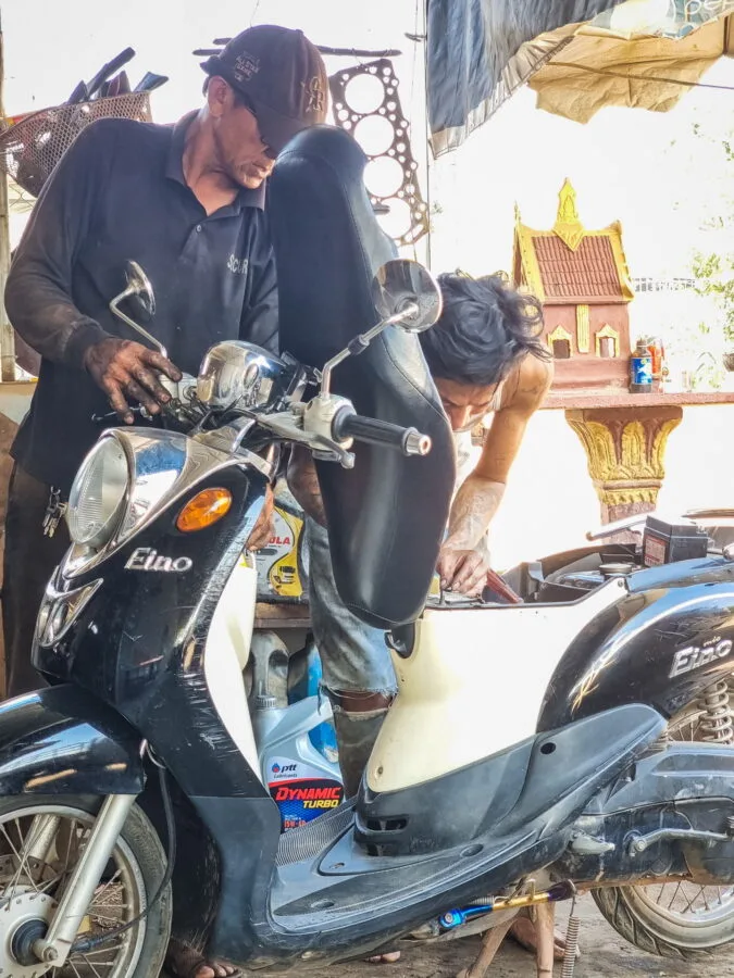 scooter repair countryside near vientiane