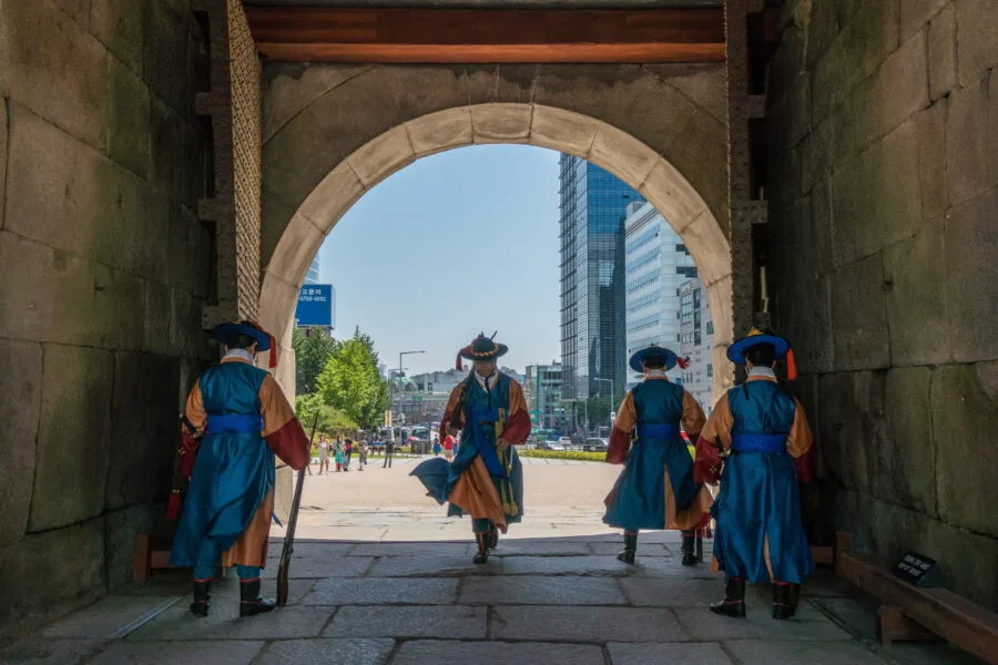guard passing under Sungnyemung namdaemun gate - seoul